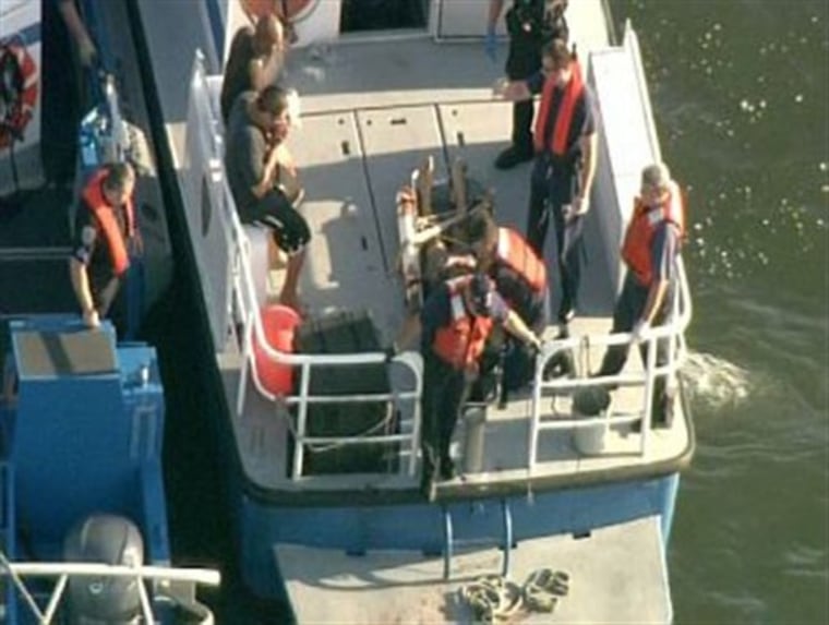 Rescue teams respond to a fatal boat accident near the Statue of Liberty in New York Harbor on Friday.